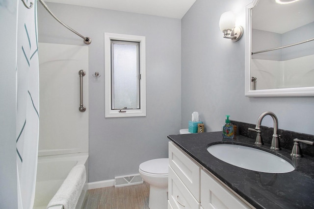 full bathroom featuring wood finished floors, visible vents, toilet, vanity, and baseboards