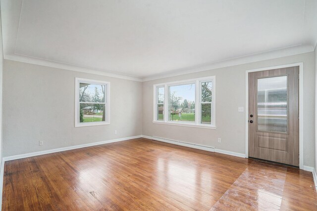 1511 Lake Ave, Portage, MI 49002 - interior space with a baseboard heating unit, baseboards, and wood finished floors