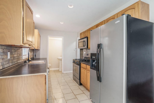 1511 Lake Ave, Portage, MI 49002 - kitchen with a sink, stainless steel appliances, backsplash, baseboards, and recessed lighting