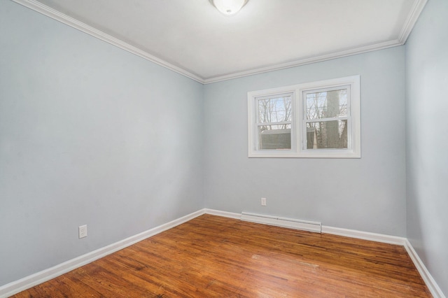1511 Lake Ave, Portage, MI 49002 - spare room with wood finished floors, baseboards, a baseboard radiator, and crown molding