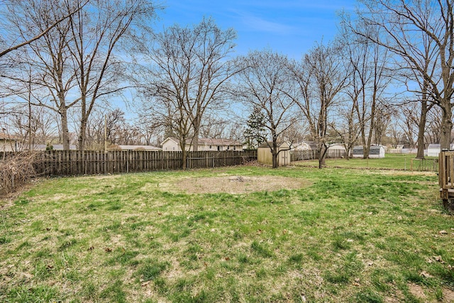 1511 Lake Ave, Portage, MI 49002 - view of yard with a fenced backyard, an outbuilding, and a storage shed