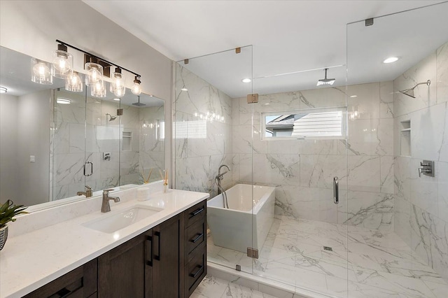 full bathroom featuring a soaking tub, marble finish floor, vanity, and a marble finish shower