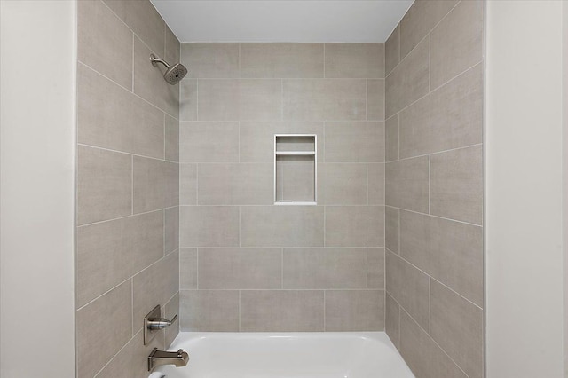 bathroom with shower / washtub combination