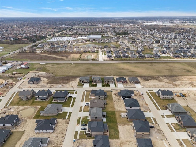 birds eye view of property with a residential view
