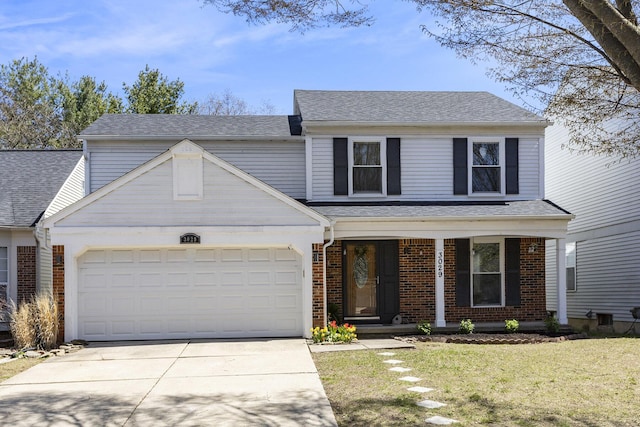 3029 Turnberry Ln, Ann Arbor, MI 48108 - traditional home featuring a front lawn, concrete driveway, covered porch, brick siding, and a garage