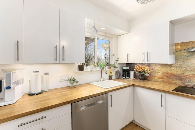 3029 Turnberry Ln, Ann Arbor, MI 48108 - kitchen with stainless steel dishwasher, a sink, butcher block countertops, and tasteful backsplash