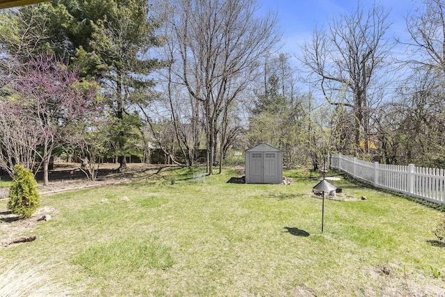3029 Turnberry Ln, Ann Arbor, MI 48108 - view of yard featuring fence, an outbuilding, and a shed