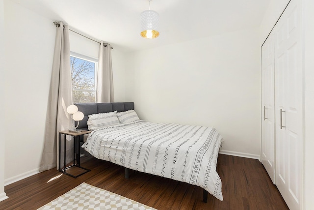3029 Turnberry Ln, Ann Arbor, MI 48108 - bedroom featuring baseboards and dark wood-type flooring