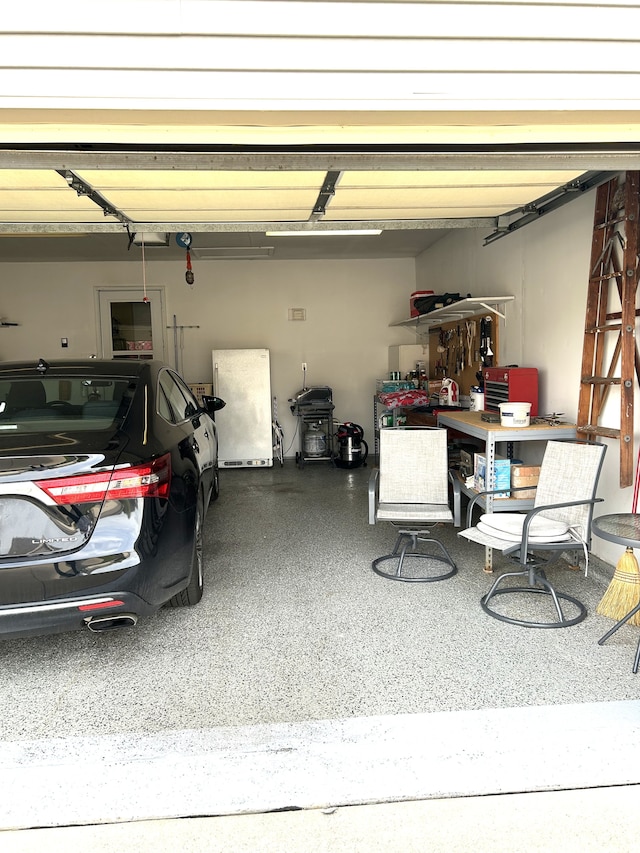 garage featuring freestanding refrigerator
