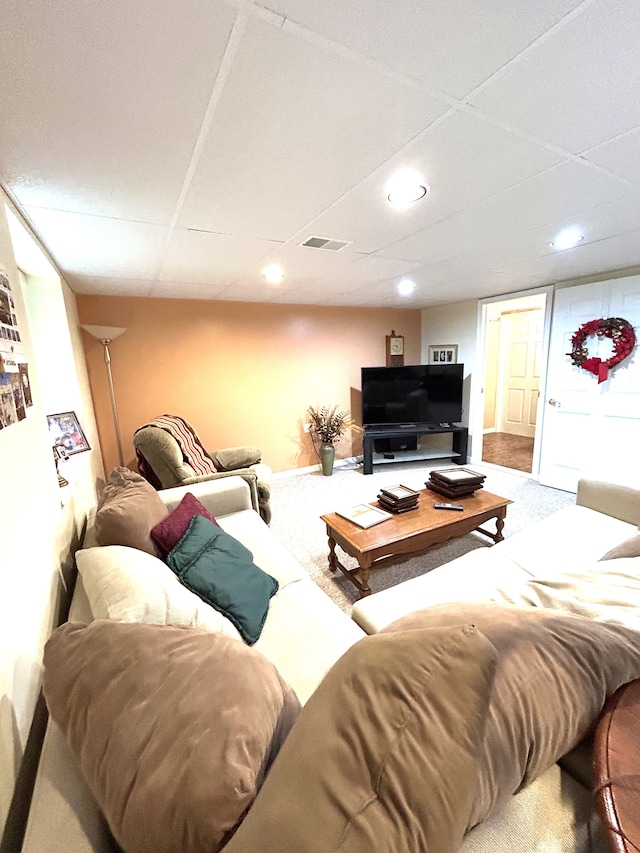 carpeted living area with recessed lighting, baseboards, and visible vents