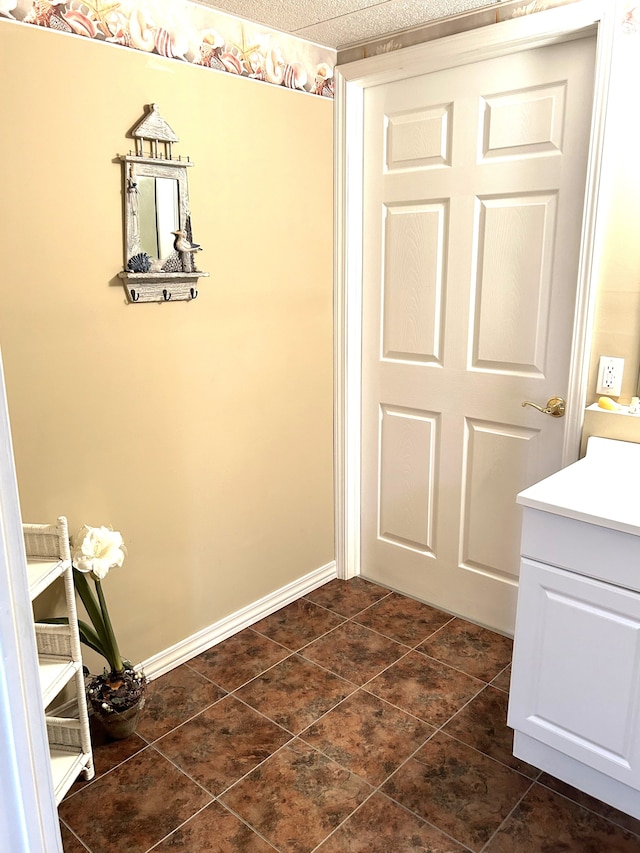 interior space with vanity and tile patterned floors