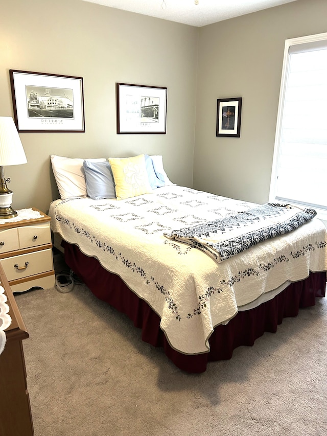 bedroom featuring light carpet