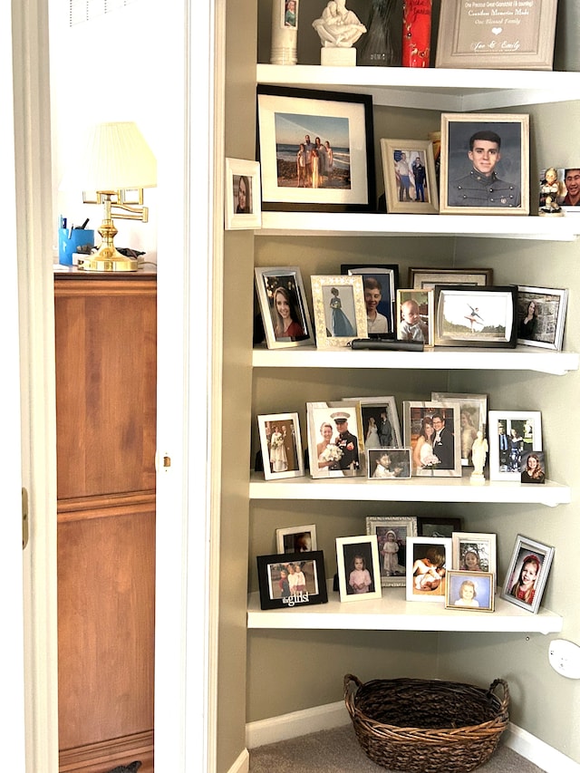 interior space with baseboards and built in shelves