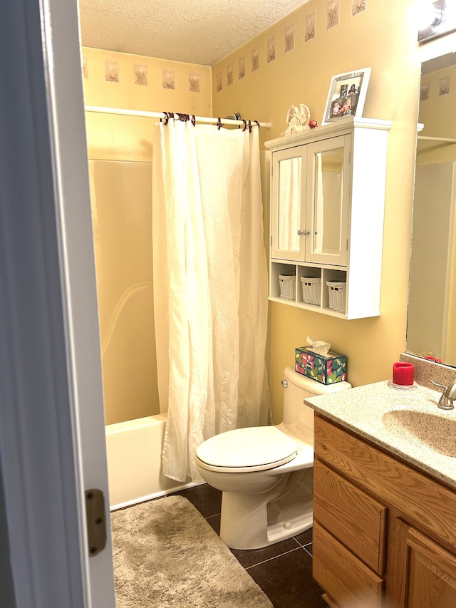 full bathroom with a textured ceiling, shower / bath combination with curtain, tile patterned flooring, vanity, and toilet