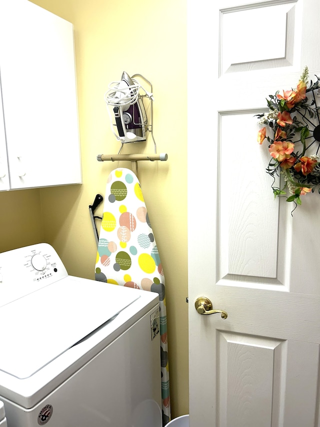 laundry room with cabinet space and washer / clothes dryer