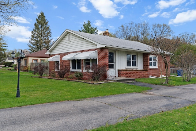 1401 S Williams Lake Rd, Waterford, MI 48327 - view of front of property with brick siding, a chimney, a front yard, and roof with shingles