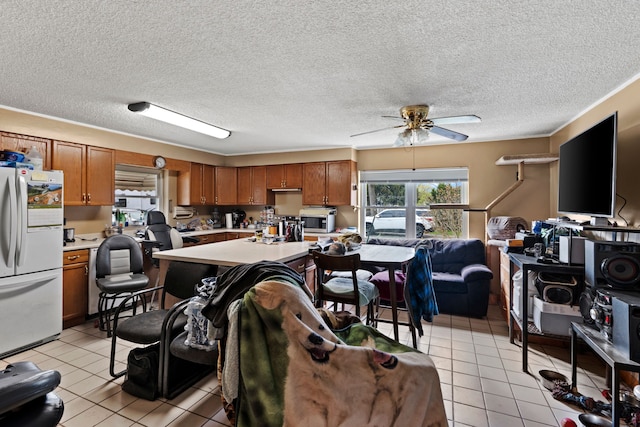1401 S Williams Lake Rd, Waterford, MI 48327 - living room with ceiling fan, light tile patterned floors, and a textured ceiling