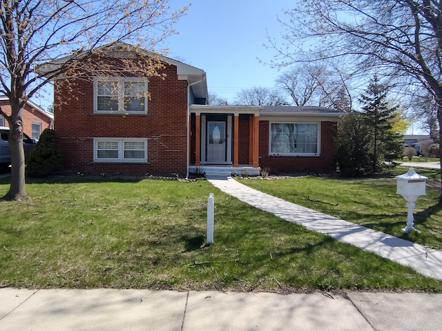 1981 Westfield Rd, Trenton, MI 48183 - tri-level home featuring a front lawn and brick siding