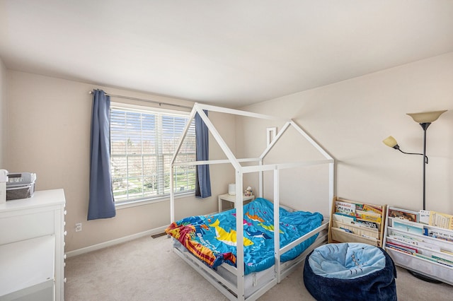 carpeted bedroom with visible vents and baseboards