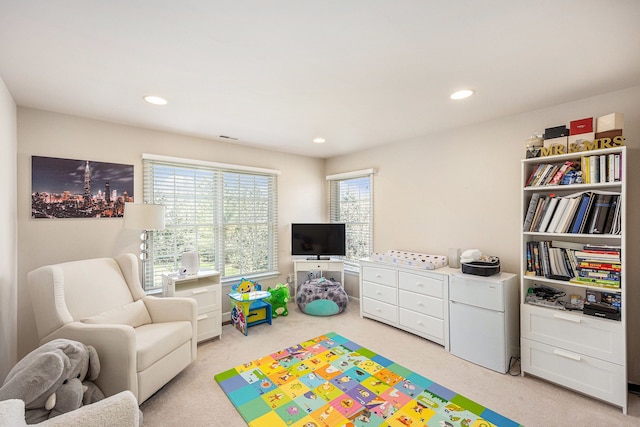 rec room featuring recessed lighting, visible vents, and light carpet