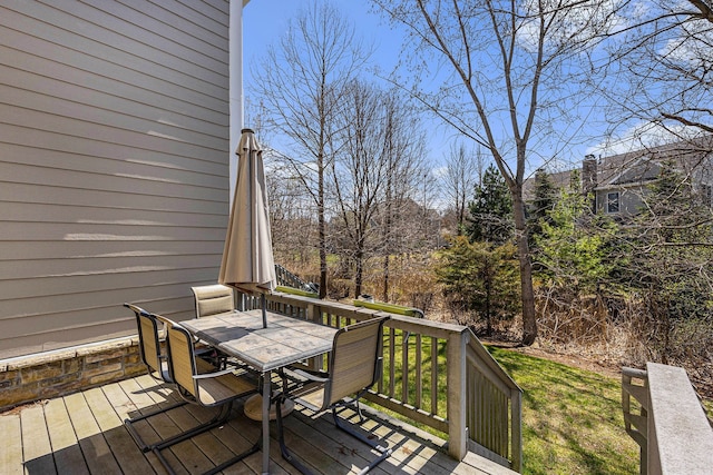 wooden terrace with outdoor dining space
