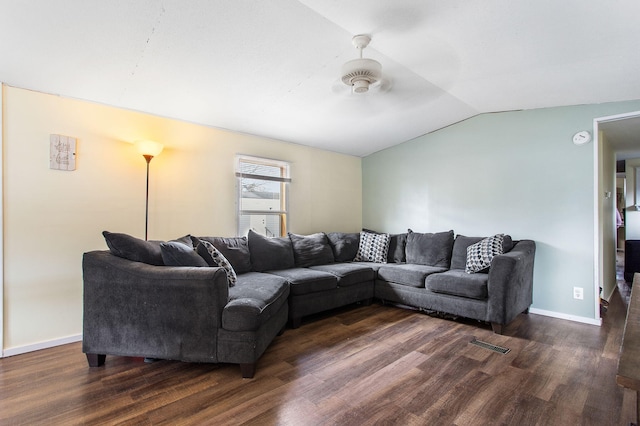 living area featuring baseboards, a ceiling fan, lofted ceiling, and dark wood-type flooring