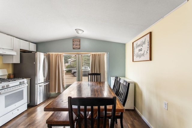 dining area with baseboards, dark wood finished floors, and vaulted ceiling