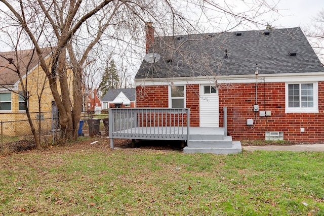 1338 Helen St, Inkster, MI 48141 - back of property featuring a chimney, roof with shingles, a lawn, a wooden deck, and fence