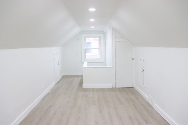 1338 Helen St, Inkster, MI 48141 - additional living space with visible vents, recessed lighting, baseboards, light wood-type flooring, and vaulted ceiling