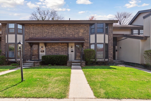 25073 Oakbrooke Dr, Southfield, MI 48033 - townhome / multi-family property featuring brick siding and a front lawn