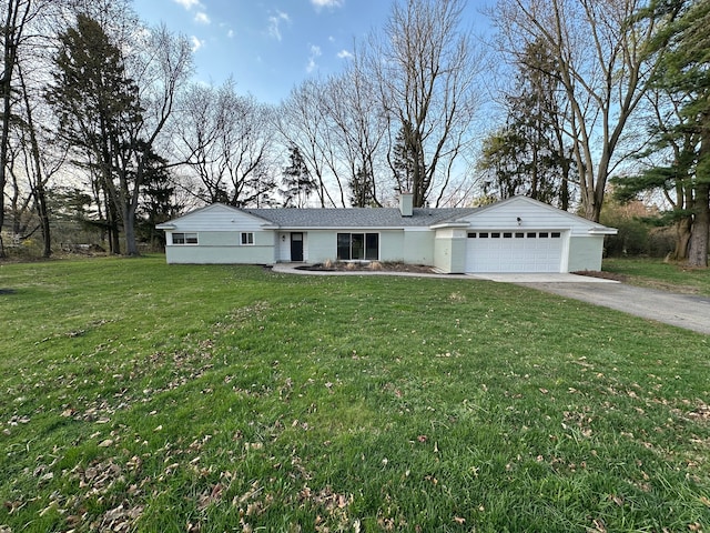 ranch-style house featuring a front yard, an attached garage, a chimney, and aphalt driveway
