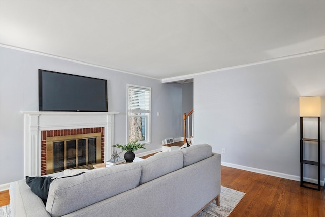 11310 Ingram St, Livonia, MI 48150 - living area featuring wood finished floors, stairway, crown molding, and a fireplace