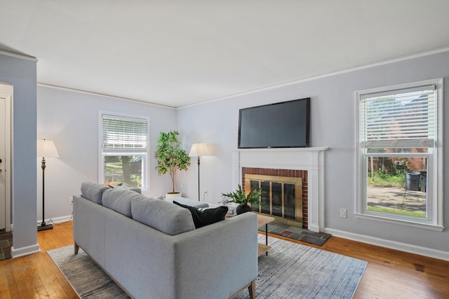 11310 Ingram St, Livonia, MI 48150 - living room with crown molding, wood finished floors, and a brick fireplace