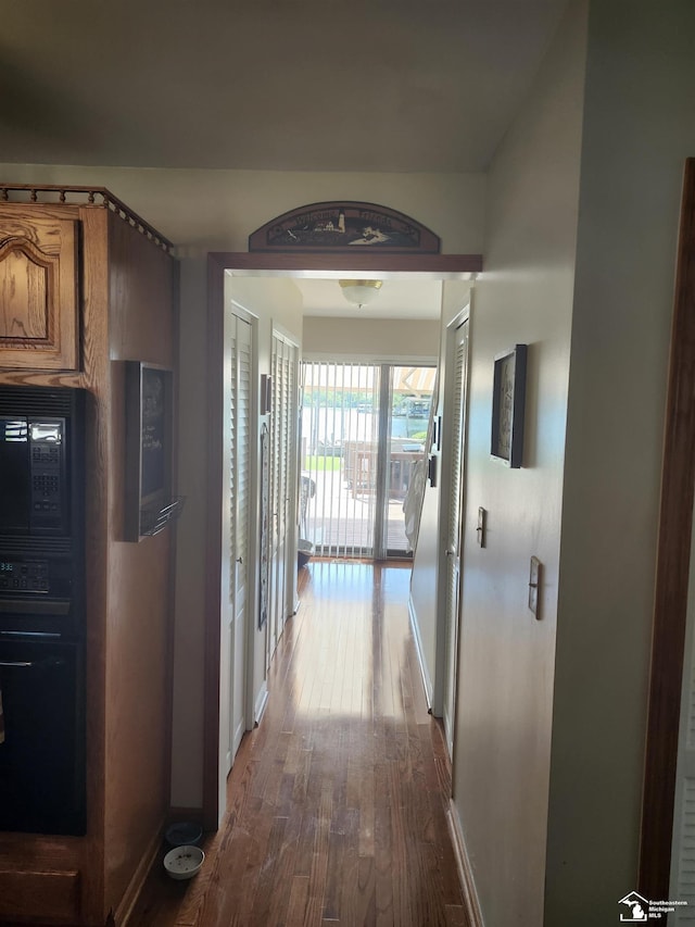 30990 Bayview Dr, Gibraltar, MI 48173 - hall featuring wood finished floors and baseboards