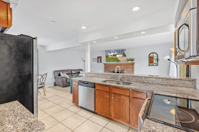 29772 Brentwood St, Southfield, MI 48076 - kitchen featuring a sink, open floor plan, appliances with stainless steel finishes, brown cabinets, and light tile patterned floors