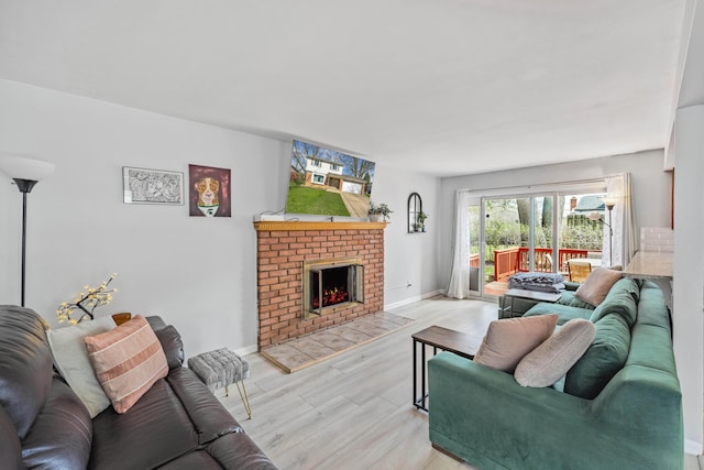 29772 Brentwood St, Southfield, MI 48076 - living room with a fireplace, wood finished floors, and baseboards