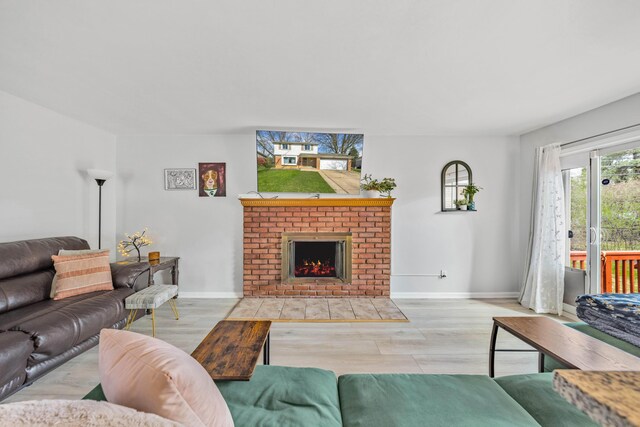 29772 Brentwood St, Southfield, MI 48076 - living room with a fireplace, wood finished floors, and baseboards