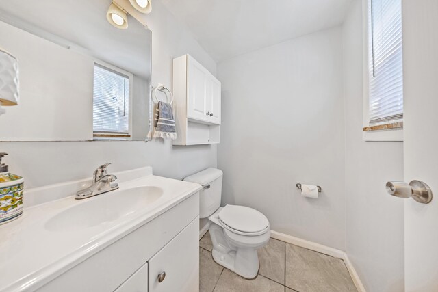 29772 Brentwood St, Southfield, MI 48076 - half bathroom featuring toilet, vanity, tile patterned floors, and baseboards