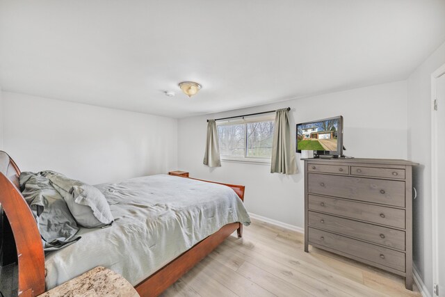 29772 Brentwood St, Southfield, MI 48076 - bedroom featuring baseboards and wood finished floors