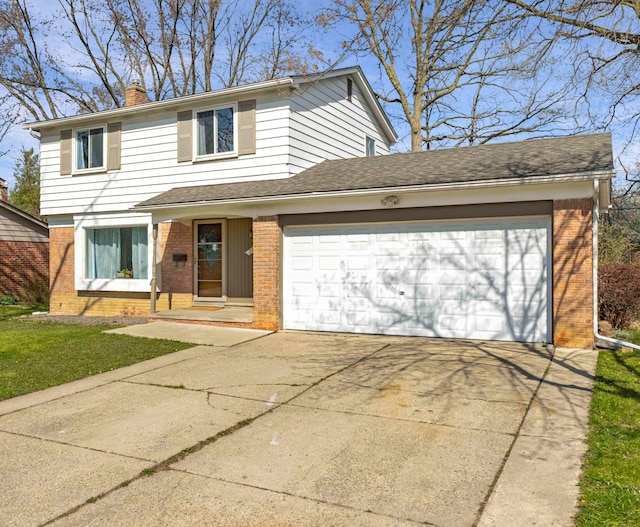 29772 Brentwood St, Southfield, MI 48076 - view of front facade featuring a chimney, driveway, a garage, brick siding, and roof with shingles