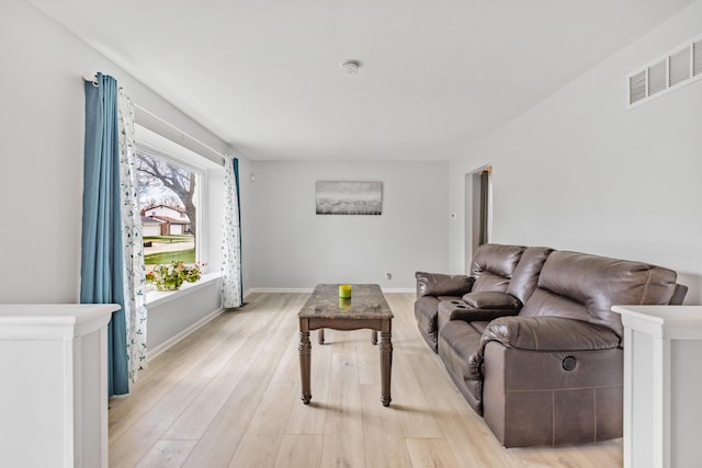 29772 Brentwood St, Southfield, MI 48076 - living room with light wood finished floors, baseboards, and visible vents