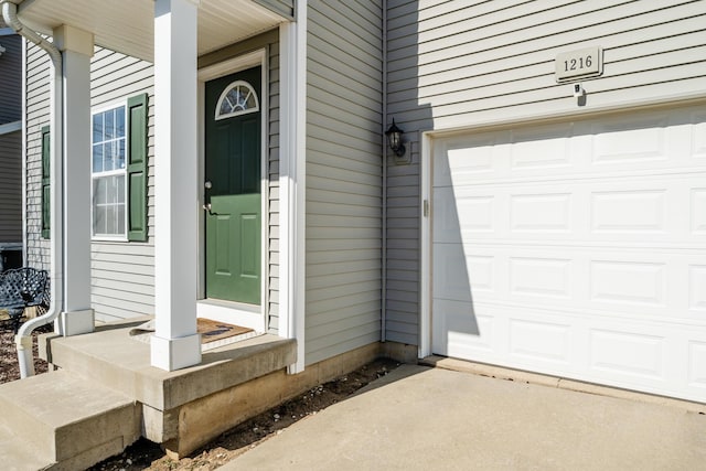 1216 Ellery Grove Ct, Vicksburg, MI 49097 - property entrance featuring a garage