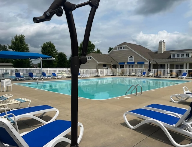 1216 Ellery Grove Ct, Vicksburg, MI 49097 - community pool with a patio and fence
