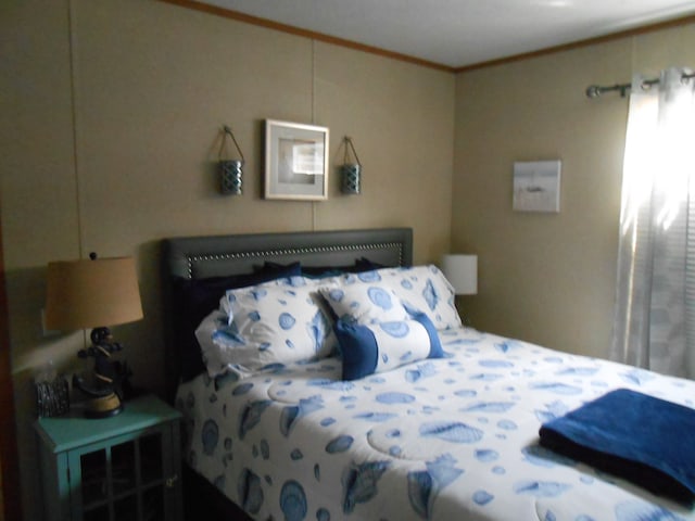 bedroom featuring crown molding