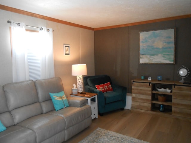 living room with light wood finished floors and ornamental molding