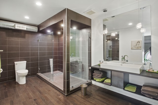 3401 Michigan Ave, Detroit, MI 48216 - bathroom featuring toilet, recessed lighting, a stall shower, and wood finished floors