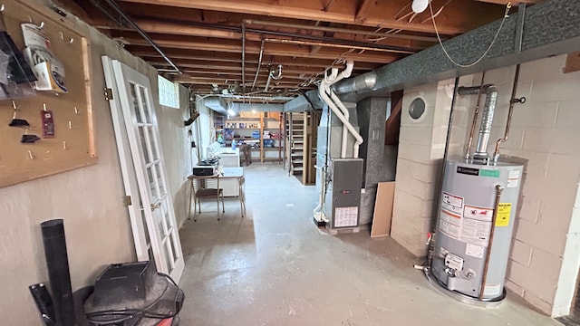 unfinished basement featuring heating unit and gas water heater