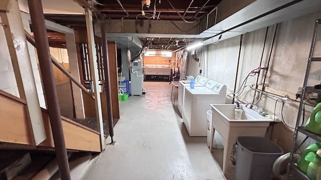 unfinished below grade area featuring washer and dryer