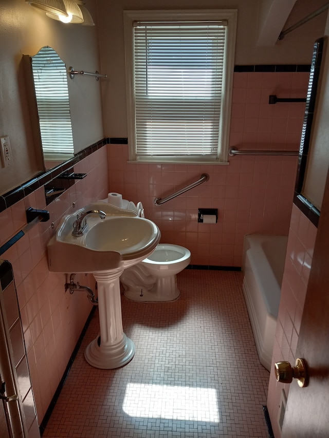7661 Penrod St, Detroit, MI 48228 - bathroom with tile walls, a shower, a wainscoted wall, and a tub to relax in