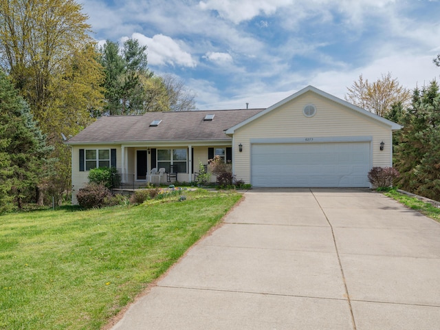 6273 S 12th St, Portage, MI 49024 - single story home featuring a garage, covered porch, concrete driveway, and a front yard